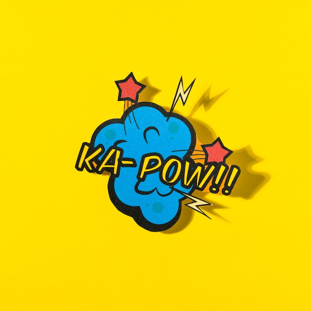 Free photo k-pow word comic book effect on yellow background