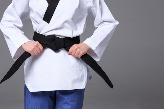 Free photo the karate girl with black belt