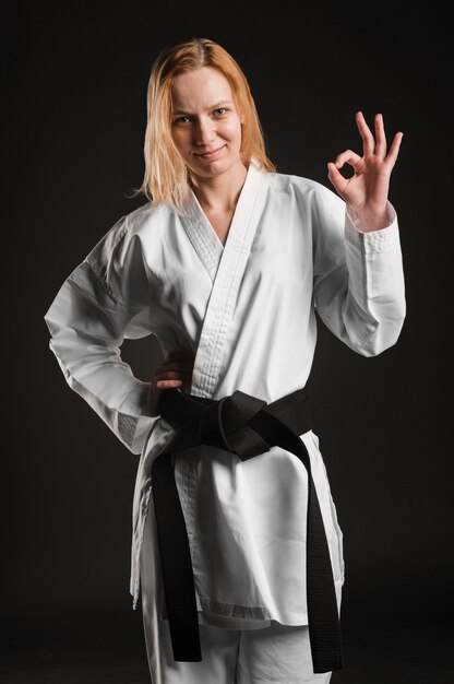 Karate woman showing ok sign