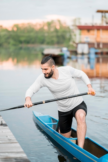 Free photo kayaking concept with young man