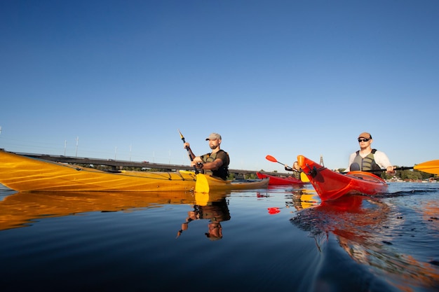 Kayaking Man paddling a kayak Canoeing paddling