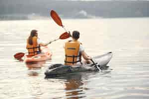 Free photo kayaking. a women in a kayak. girls paddling in the water.