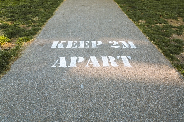 Free Photo keep 2m apart written on the ground- the concept of social distancing