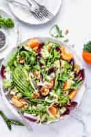 Free photo keto salad with clementines and avocado healthy food