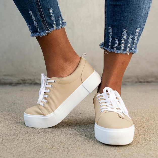 Free photo khaki canvas sneakers women’s shoes apparel shoot