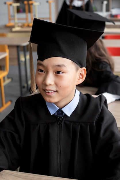 Kid celebrating kindergarten graduation