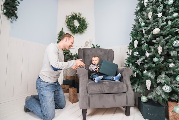 Kid on couch with big present