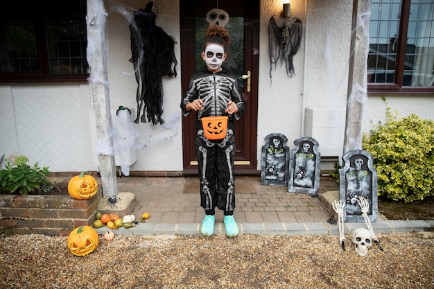 Free photo kid in cute but scary skeleton costume