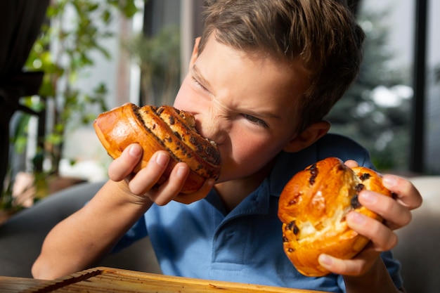 Kid eating dessert close up