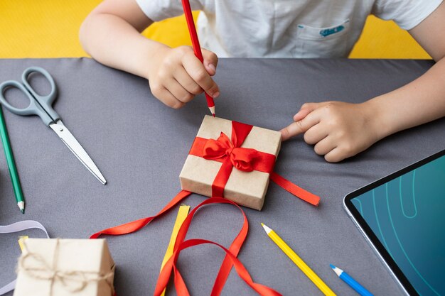 Kid learning how to make a gift