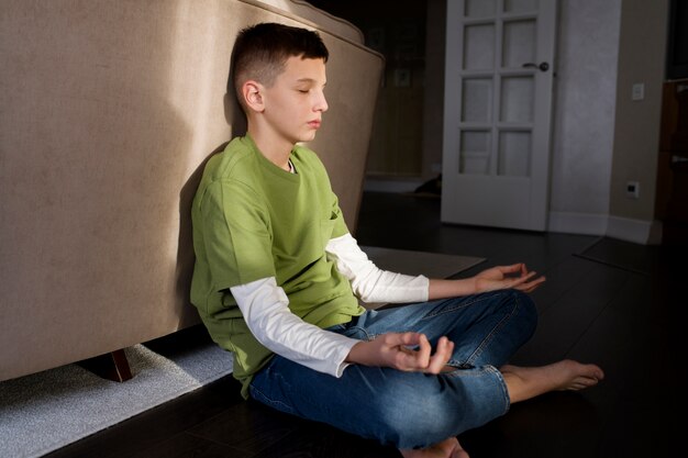 Kid meditating and focusing