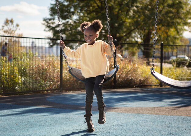 Kid playing outdoorns in the park