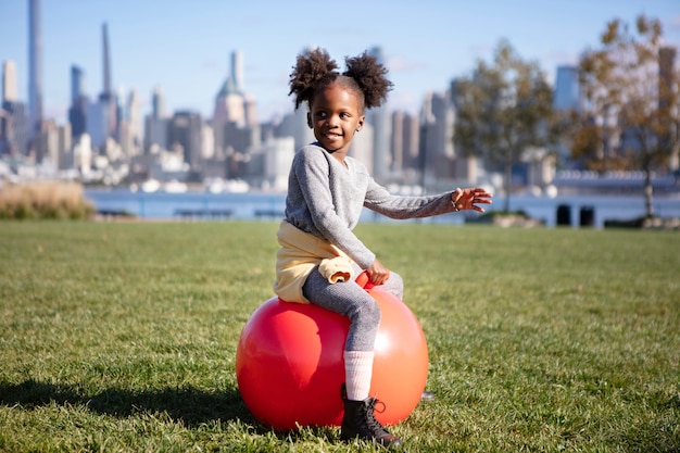 Kid playing outdoorns in the park