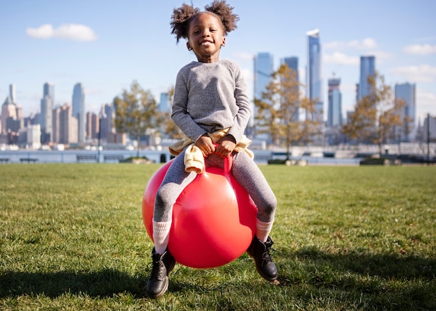 Kid playing outdoorns in the park