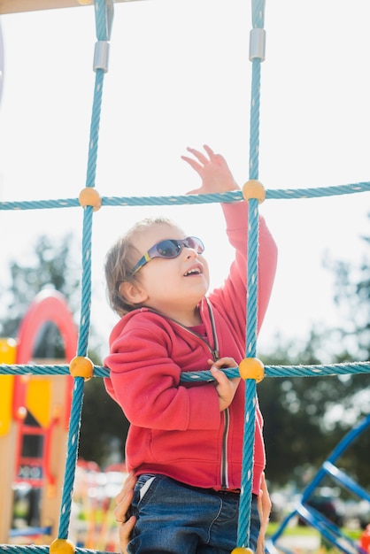 Kid playing outside on playground