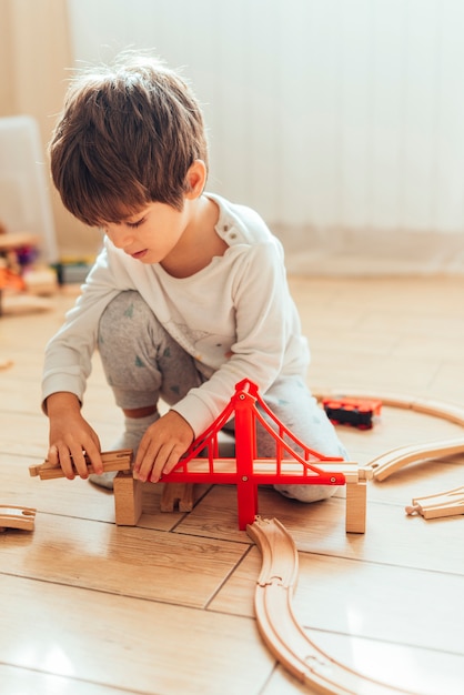 Kid playing with toy train