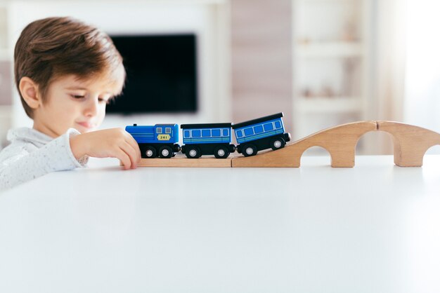 Kid playing with toy train