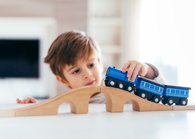 Kid playing with toy train