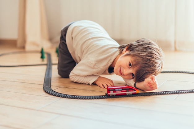 Kid playing with toy train