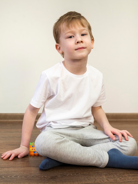 Kid sitting on the floor indoors