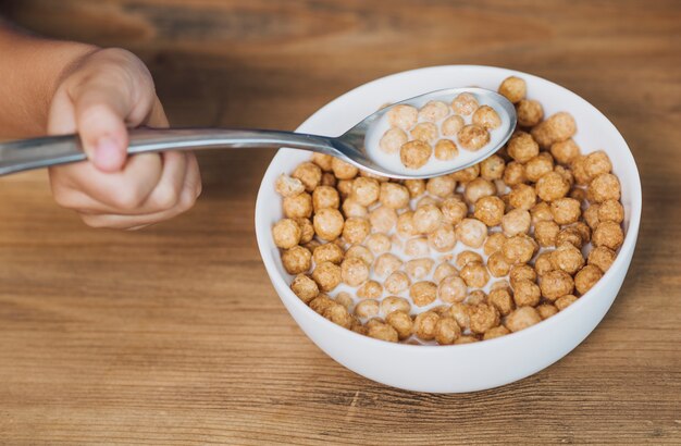 Kid taking a spoon of cereal