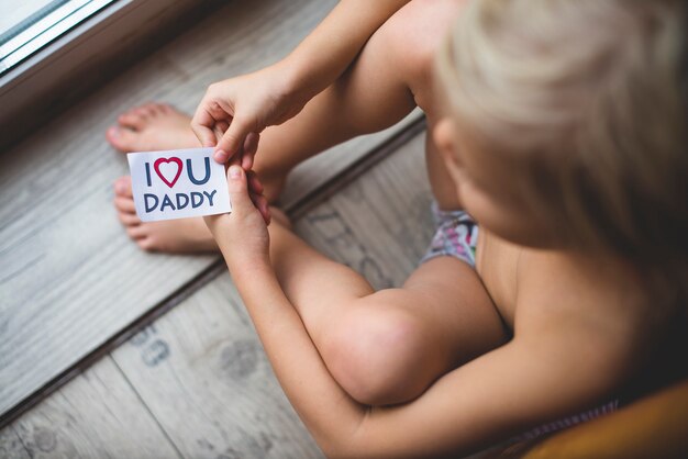 Kid with beautiful note for his dad