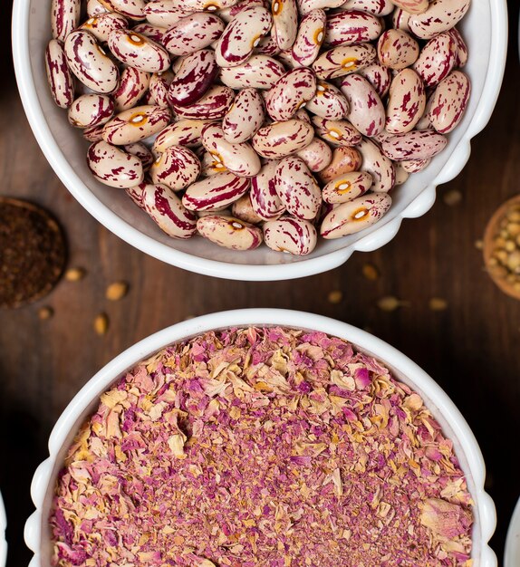 Kidney beans and spices in white bowls