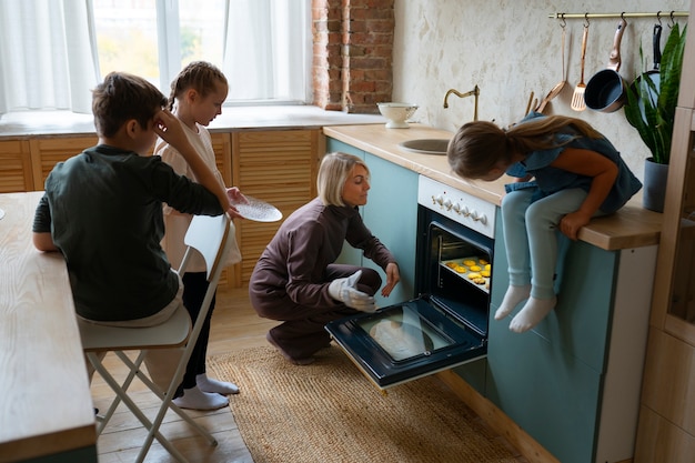 Free photo kids baking cookies side view