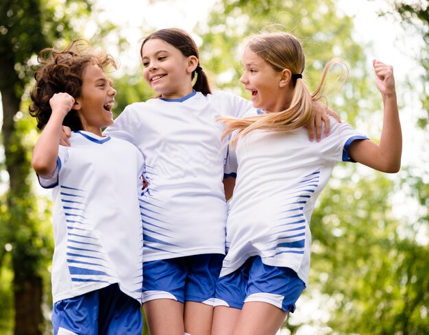 Kids being enthusiast after winning a football match