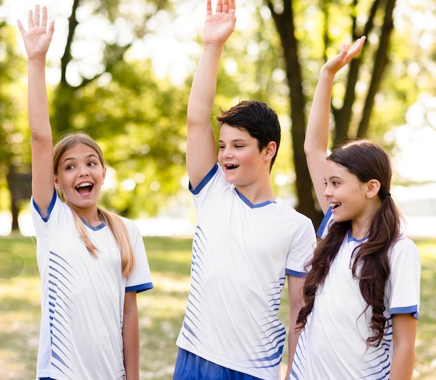 Kids being happy after winning a football match