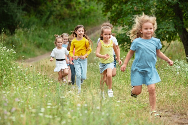 Free Photo kids, children running on green meadow