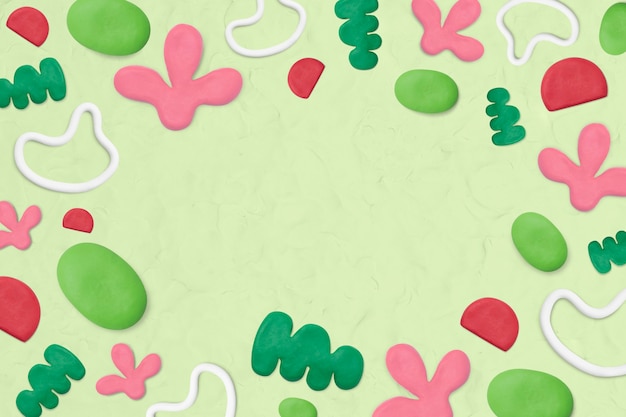 Kids clay patterned frame on green textured background creative craft for kids