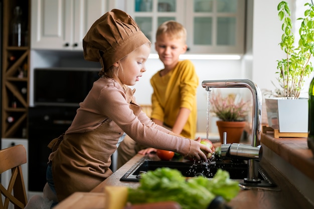 Free Photo kids cooking and having fun at home