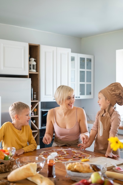 Free photo kids cooking and having fun at home