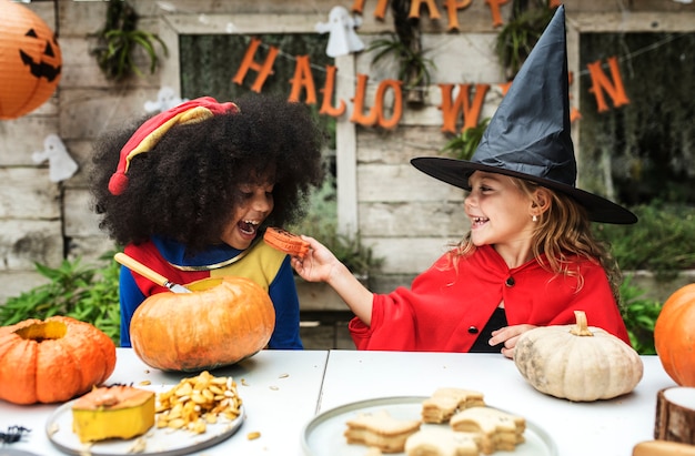 Free photo kids in costume enjoying the halloween season