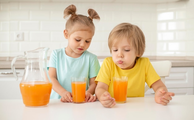 Free photo kids drinking juice