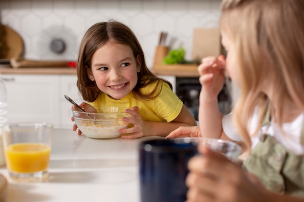 Free photo kids eating together with their family