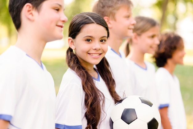 Kids getting ready for a football match outdoors