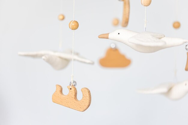 Kids handmade toys above the newborn crib