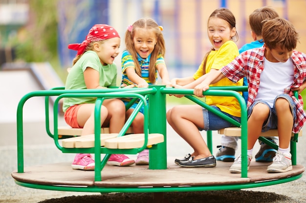 Kids having fun on carousel