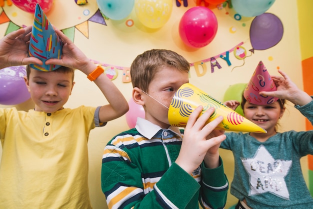 Kids having fun with party hats