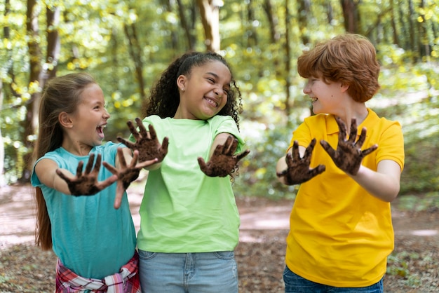 Kids having their hands dirty after planting