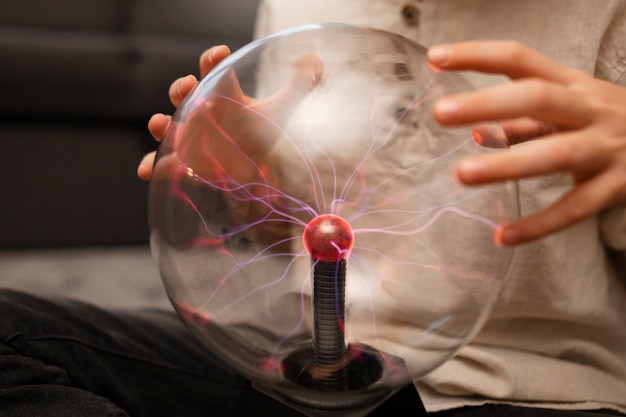 Free Photo kids interacting with a plasma ball