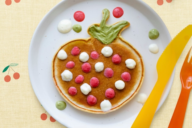 Free photo kids pancake breakfast treat background, shaped like a fun strawberry wallpaper