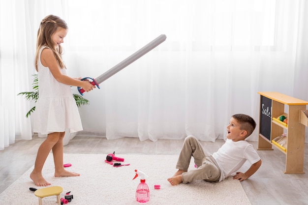 Kids playing with sword toys