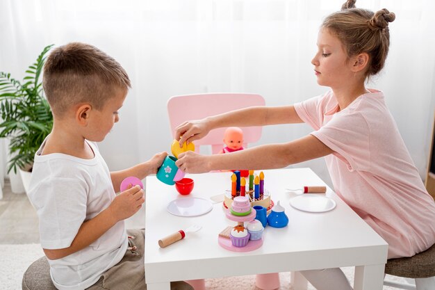 Kids playing with a tea game