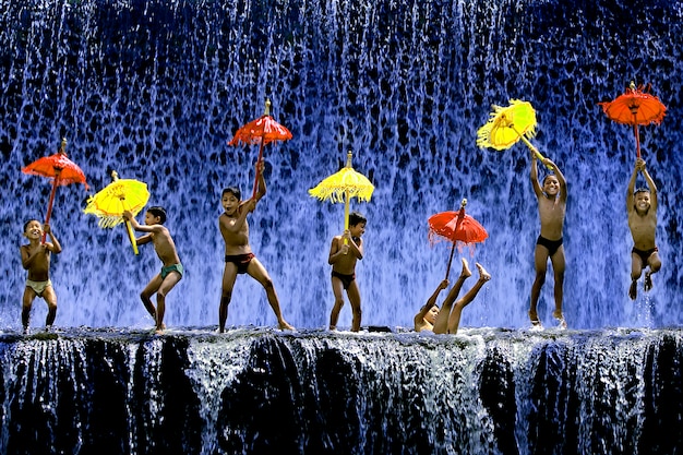 Kids playing with umbrellas