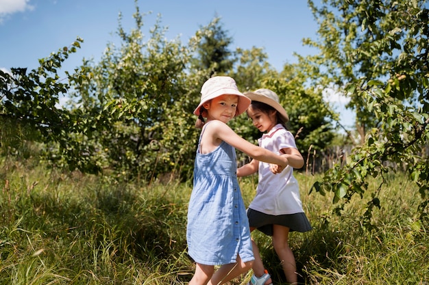 Kids spending time outdoors in a rural area enjoying childhood