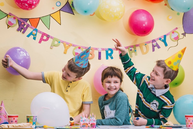 Kids taking selfie on birthday party