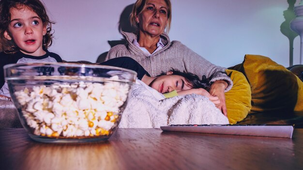 Kids with mother watching TV